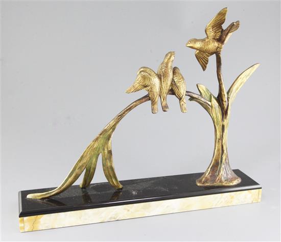 Michel Decoux. An Art Deco gilt bronze group of four birds perched upon a branch, width 20in. height 16in.